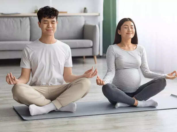 pregnant couple exercising