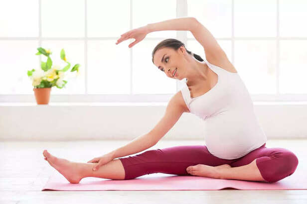 pregnant woman doing yoga
