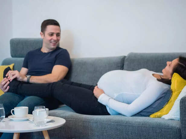 pregnant couple discussing parenting roles