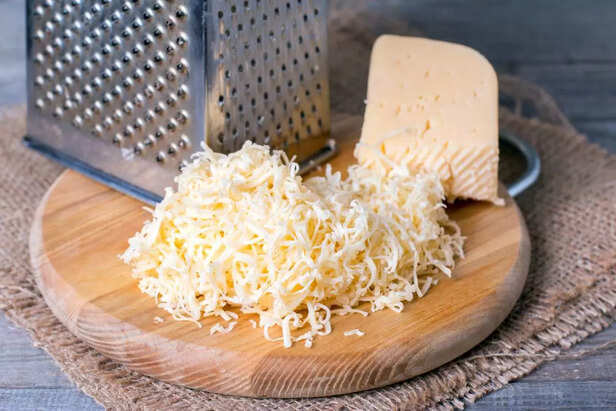 Grated cheese with grater