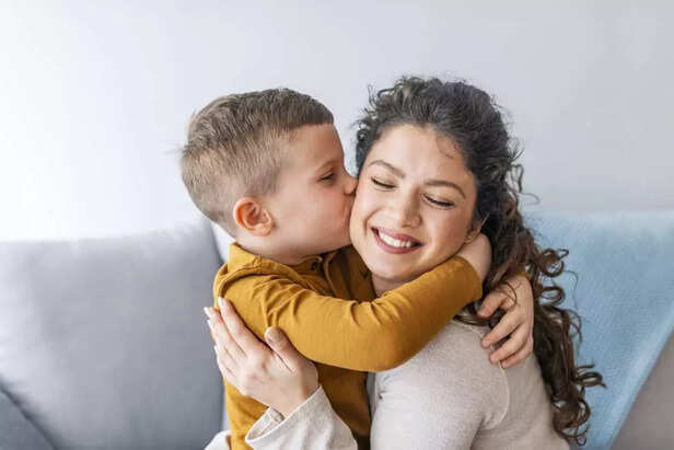 Son is kissing his mother