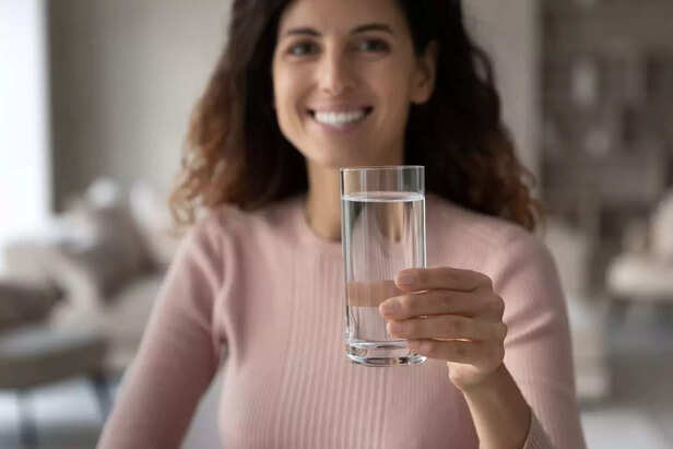 pregnant woman drinking water