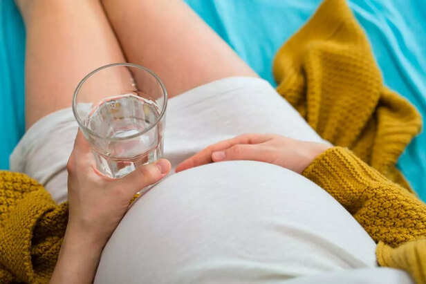 Pregnant woman drinking water