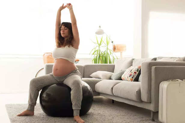 Pregnant woman doing relax exercises